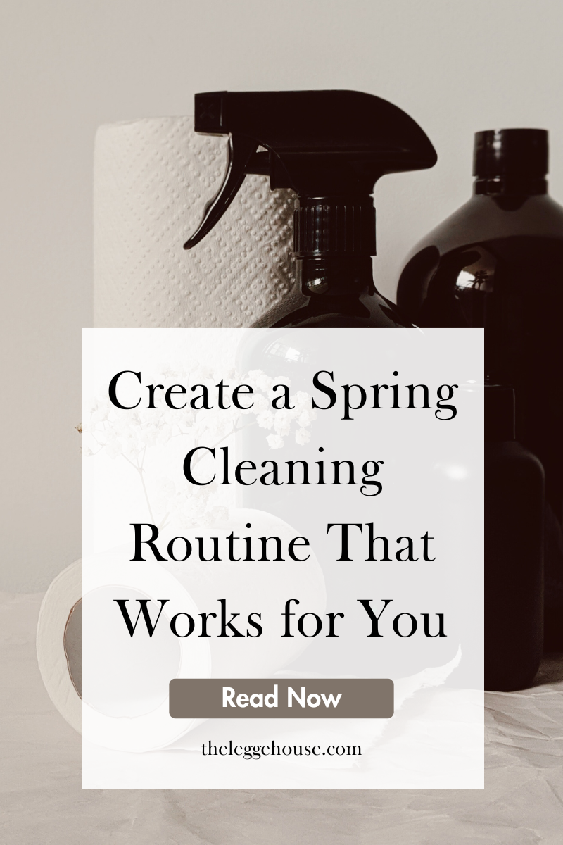 Image of cleaning supplies including a spray bottle and paper towels with text that reads: "Create a Spring Cleaning Routine That Works For You" theleggehouse.com
